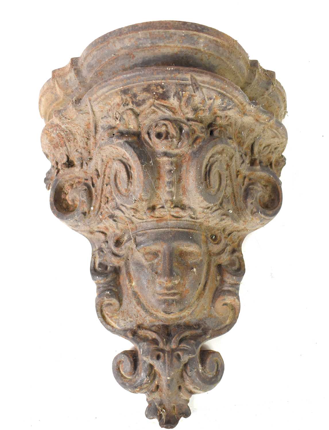 A 19th century cast iron corbel in the form of a face mask within a cartouche, 37cm.