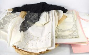 A group of vintage fabrics to include tablecloth and place mat sets, quantity of antique black