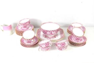 A 19th century part tea set, pink primrose pattern, cups, saucers, sugar bowl and plates.