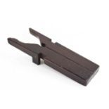 A 19th century treen travelling boot remover, hinged to the centre opens out onto two raised blocks,