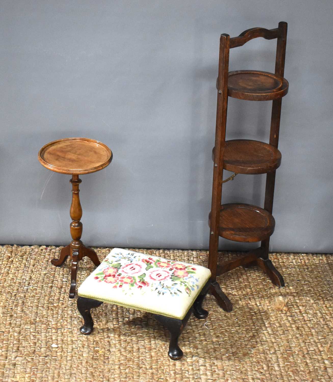 A 19th century mahogany wine table together with an oak folding cake stand a upholstered stool.