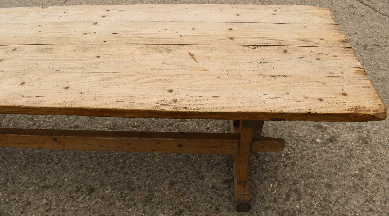 A large pine country trestle table with long planked top above a double stretcher base, 298cm by - Image 3 of 3