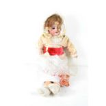 An early 20th century SFBJ Paris doll, bisque head, open and close eyes, jointed limbs and