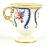 An early 19th century French sorbet cup, manner of Sevres, painted with flowers in blue panels, C