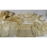 A collection of antique lace and embroidered net to include dress pieces, handkerchiefs, collars,