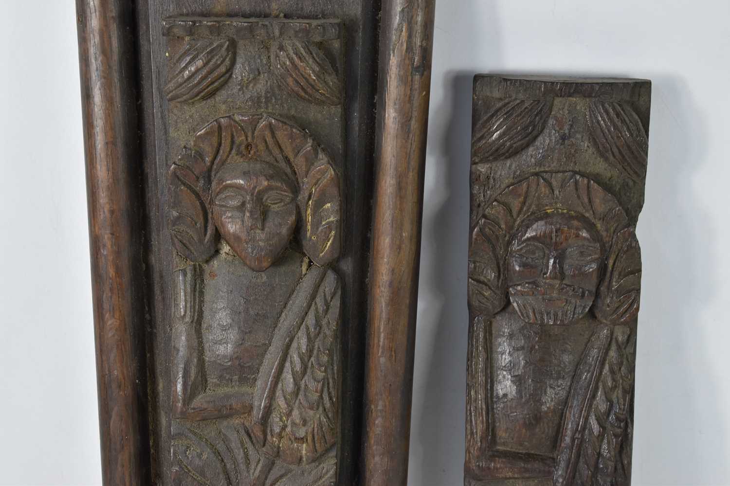 A pair of 17th century oak carved telemon terms, possibly depicting Charles I, 38.5cm by 10cm. [ - Image 3 of 3