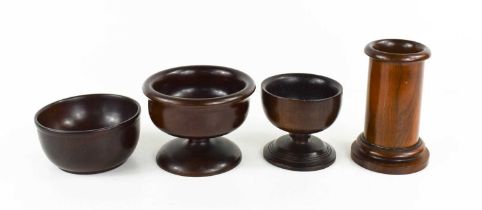 Four pieces of treen, to include a cylindrical brush holder, two standing salts, a hardwood turned