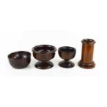 Four pieces of treen, to include a cylindrical brush holder, two standing salts, a hardwood turned