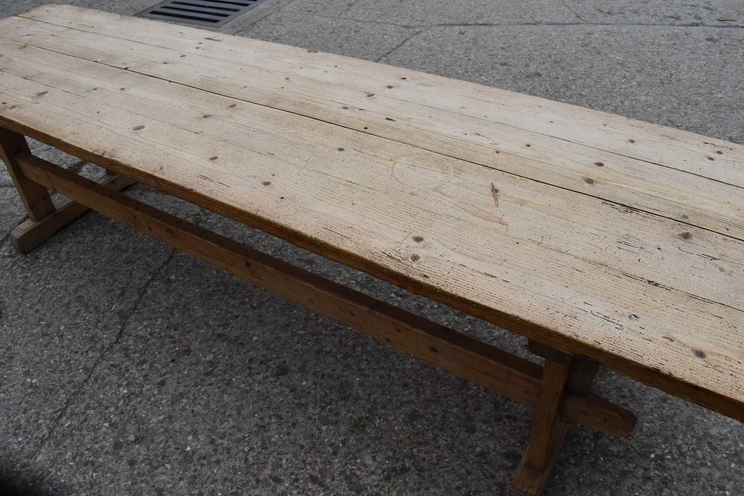 A large pine country trestle table with long planked top above a double stretcher base, 298cm by - Image 2 of 3