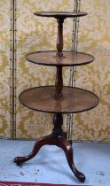 A 19th century mahogany three tier dumb waiter, the graduated circular tiers united by baluster