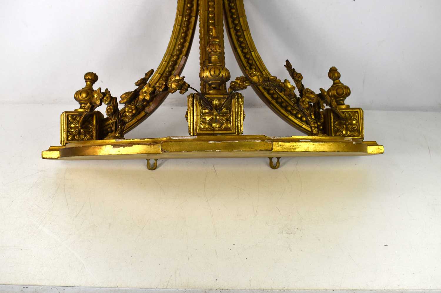 A 19th century French gilt wood wall console decorated with garlands and rocailles, 52.5cm by 61cm. - Image 2 of 2