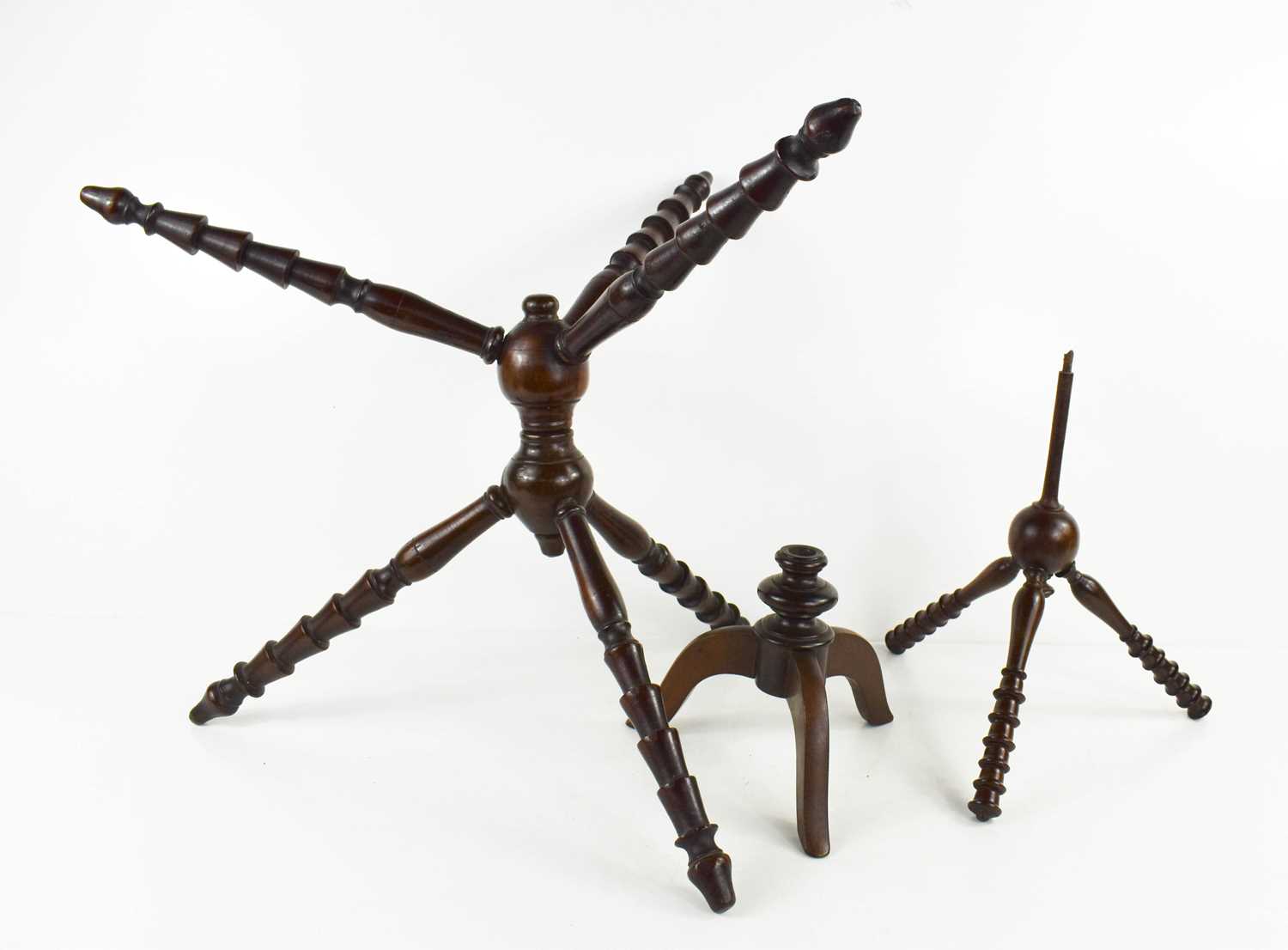 A treen Georgian mahogany Sussex cat, constructed from six turned legs, united by a central double