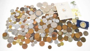 A collection of 19th and 20th century coins to include a silver Rupee, George III coins,