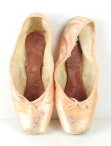 A pair of ballet pointe shoes both signed by Darcey Bussell, size 5 1/2, made by Freed of London.