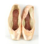 A pair of ballet pointe shoes both signed by Darcey Bussell, size 5 1/2, made by Freed of London.