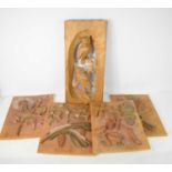A group of four Italian hand carved wall hangings, carved with various plants and fruits, 27.5cm