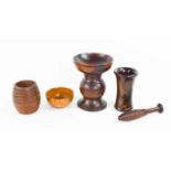 A small apothecaries pestle and mortar, the pestle of reeded form, together with a pedestal lignum