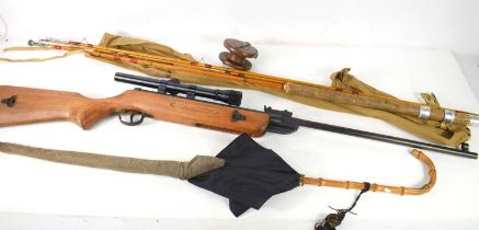 A vintage West Lake air rifle together with a vintage ladies parasol, a split cane fishing rod and a