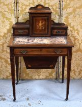 An Edwardian rosewood ladies work table, the raised back having a single cupboard door flanked by