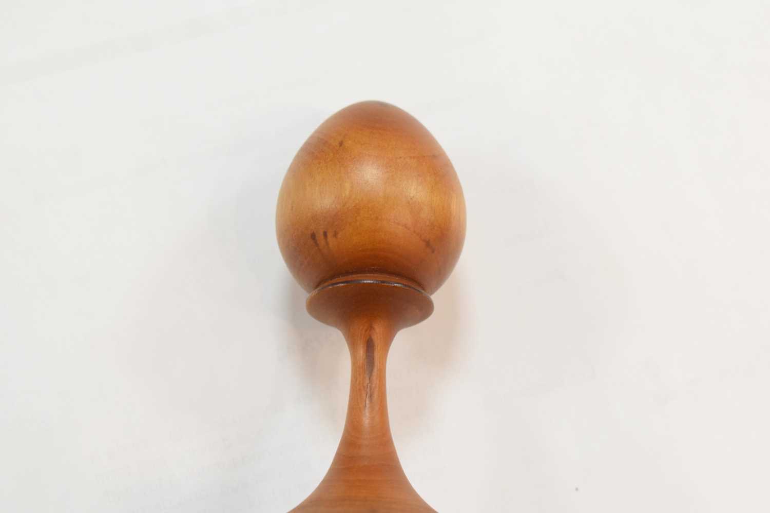 A group of treen sewing aids, to include a 19th century olive wood darning egg form etui, a childs - Image 11 of 14