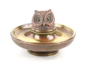 A late 19th century brass and copper novelty owl inkwell, the hinged cover cast as a large owl head,