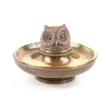 A late 19th century brass and copper novelty owl inkwell, the hinged cover cast as a large owl head,