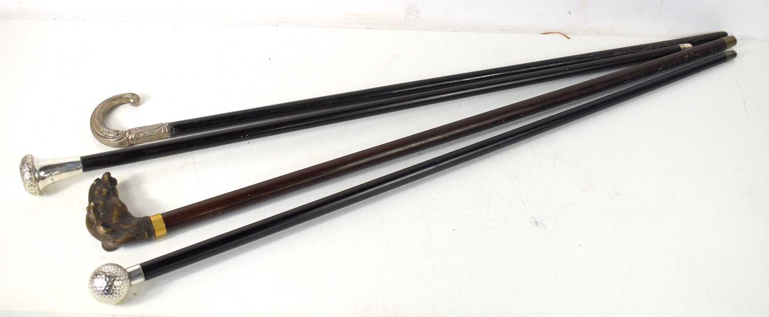 A group of vintage walking canes, two having silver handles, the other having a handle in the form - Image 2 of 2