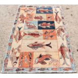 An Afghan wool rug, depicting various fishes on a cream ground, 121 by 178cm.