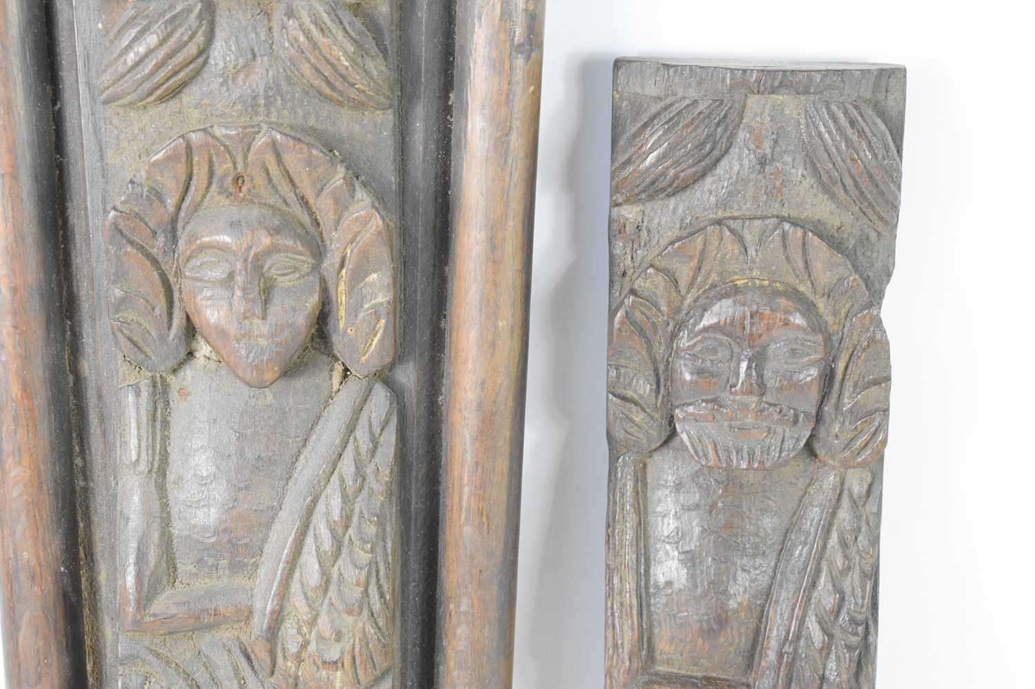 A pair of 17th century oak carved telemon terms, possibly depicting Charles I, 38.5cm by 10cm. [ - Image 2 of 3