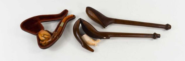 A 19th century clay pipe, with treen pipe case, likely birchwood, the long knop neck tapering to a