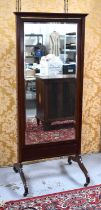 A 19th century mahogany cheval mirror with moulded top, bevelled mirror plate and raised on brass