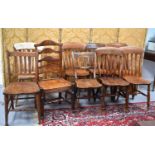A harlequin set of five elm kitchen chairs, an oak jadiniere stand and a 19th century elm ladderback
