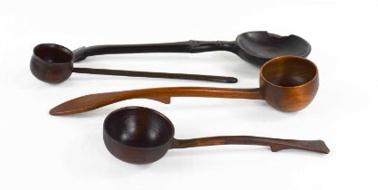 A group of 19th century treen to include a Scotch Kale skimming spoon, an 18th century ladle, a