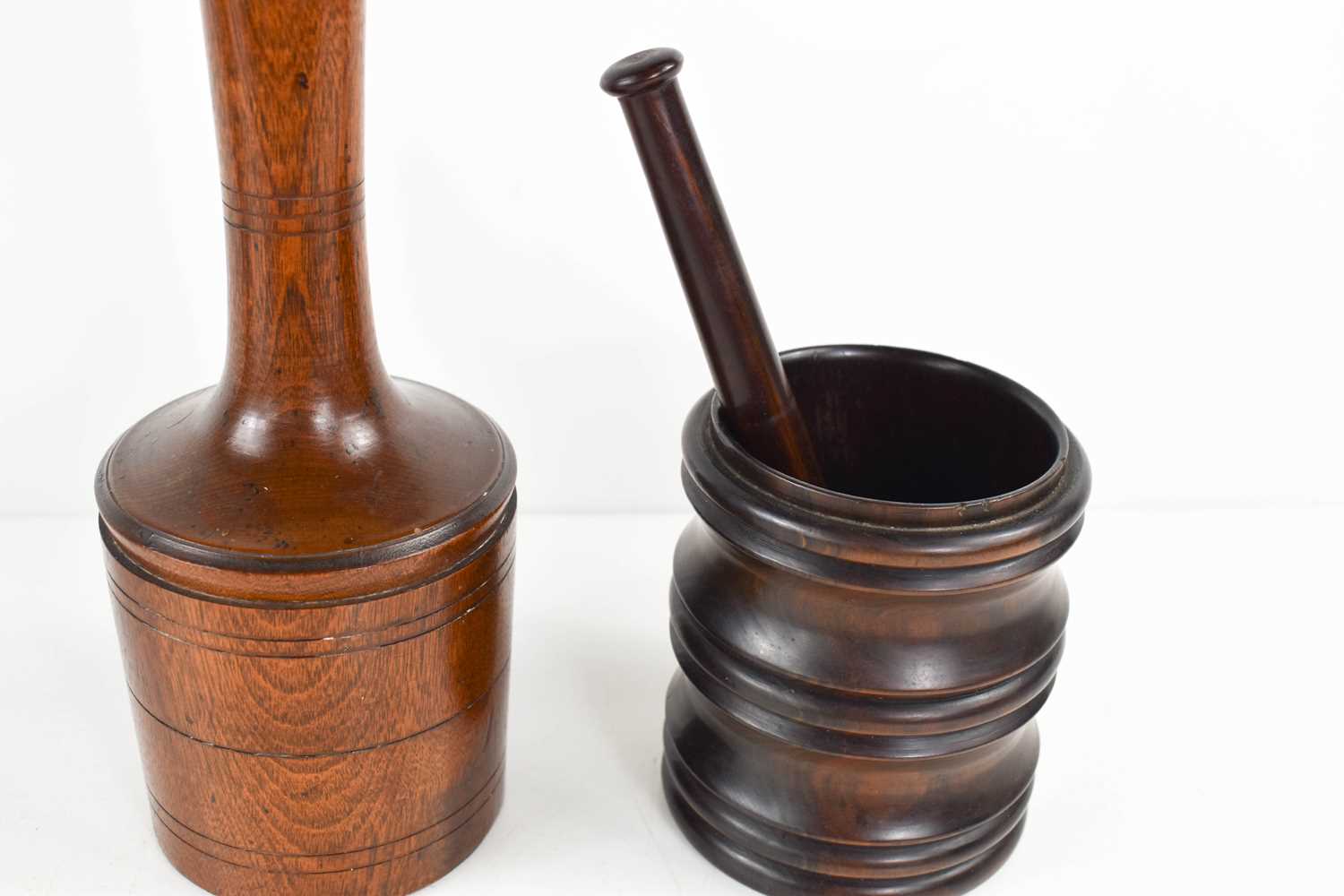 A 19th century treen potato masher, with a turned handle, and a lignum vitae mortar and matching - Image 2 of 2