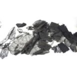 A collection of assorted black mourning lace to include a face covering, offcuts, borders and