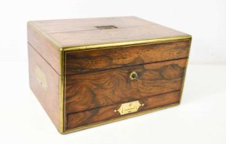 A 19th century rosewood travelling vanity case, with brass inset handles, the fitted interior