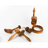 A group of 19th century treen sewing tools, to include a Georgian umbrella frame wool winder, a