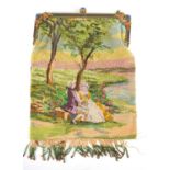 An antique micro beaded ladies purse, depicting a courting couple sat under a tree, the gilt metal