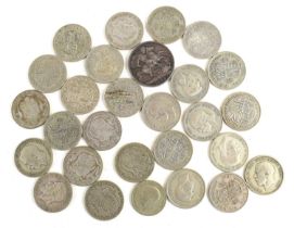 A group of silver coins comprising of a Queen Victorian crown dated 1898 and twenty five half crowns