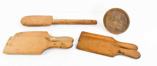 A group of Victorian pine butter hand, two pairs of butter pats and a shortbread press.