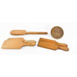 A group of Victorian pine butter hand, two pairs of butter pats and a shortbread press.