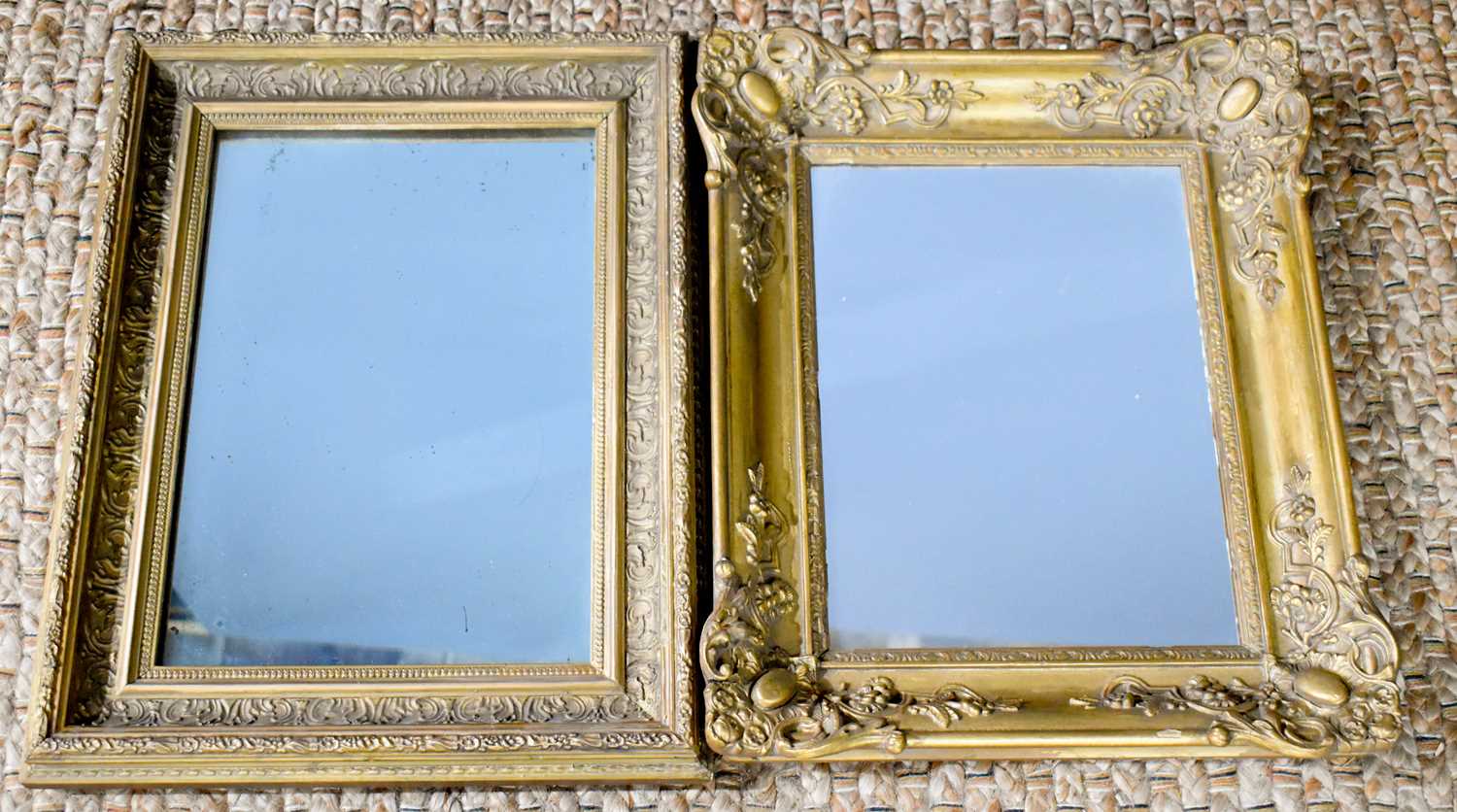 Two rectangular mirrors set in gold frames, one having deeply moulded border with decorative