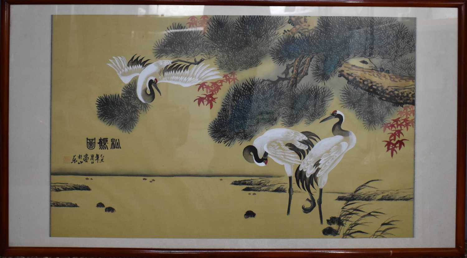 A mid 20th century Japanese painting on silk of cranes over water, bearing signature to the left
