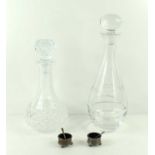 Two crystal glass decanters, one having a floral and spiral pattern, together with a pair of