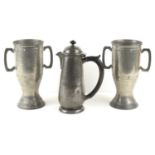 A Liberty & Co "Tudric" pewter coffee pot designed by Archibald Knox together with a pair of Twin
