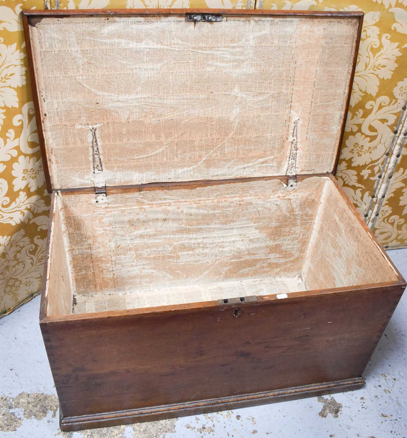 A late 19th century oak blanket chest with iron hinges, the interior lined with copies of the - Image 2 of 2