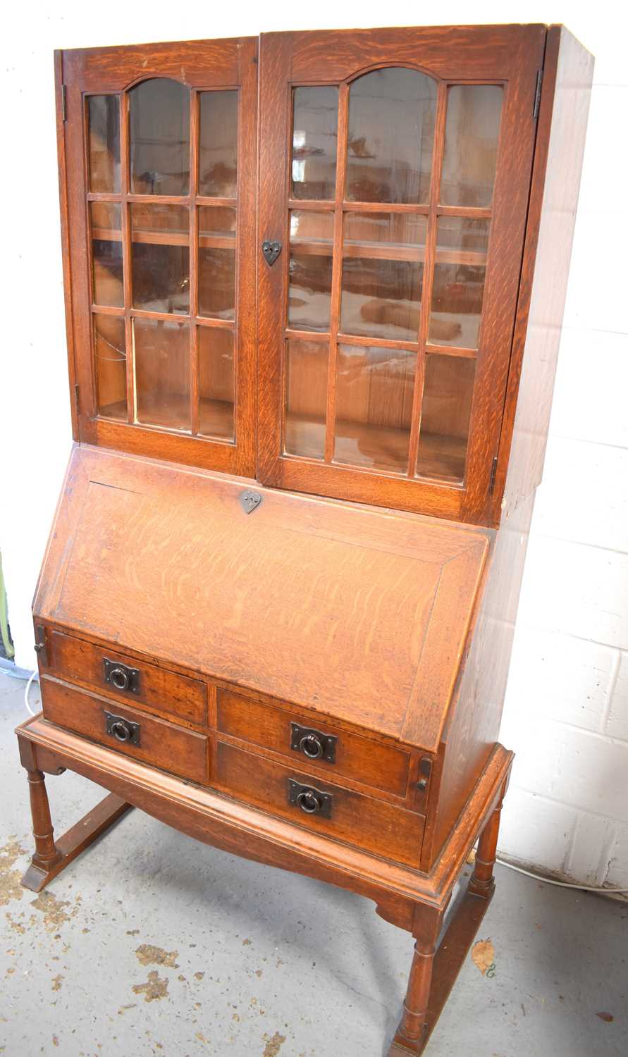 A Heals of London Art Nouveau period bureau bookcase, designed by Ambrose Heal from the Mansfield