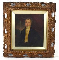 An early 19th century portrait of a gentleman, oil on canvas, signed to the back of the canvas and