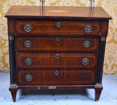 A 19th century French chest of drawers with a stepped front housing four graduated drawers flanked