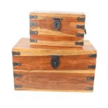 Two hardwood chests, both iron bound with iron handles, the largest measuring 25cm high by 45cm by